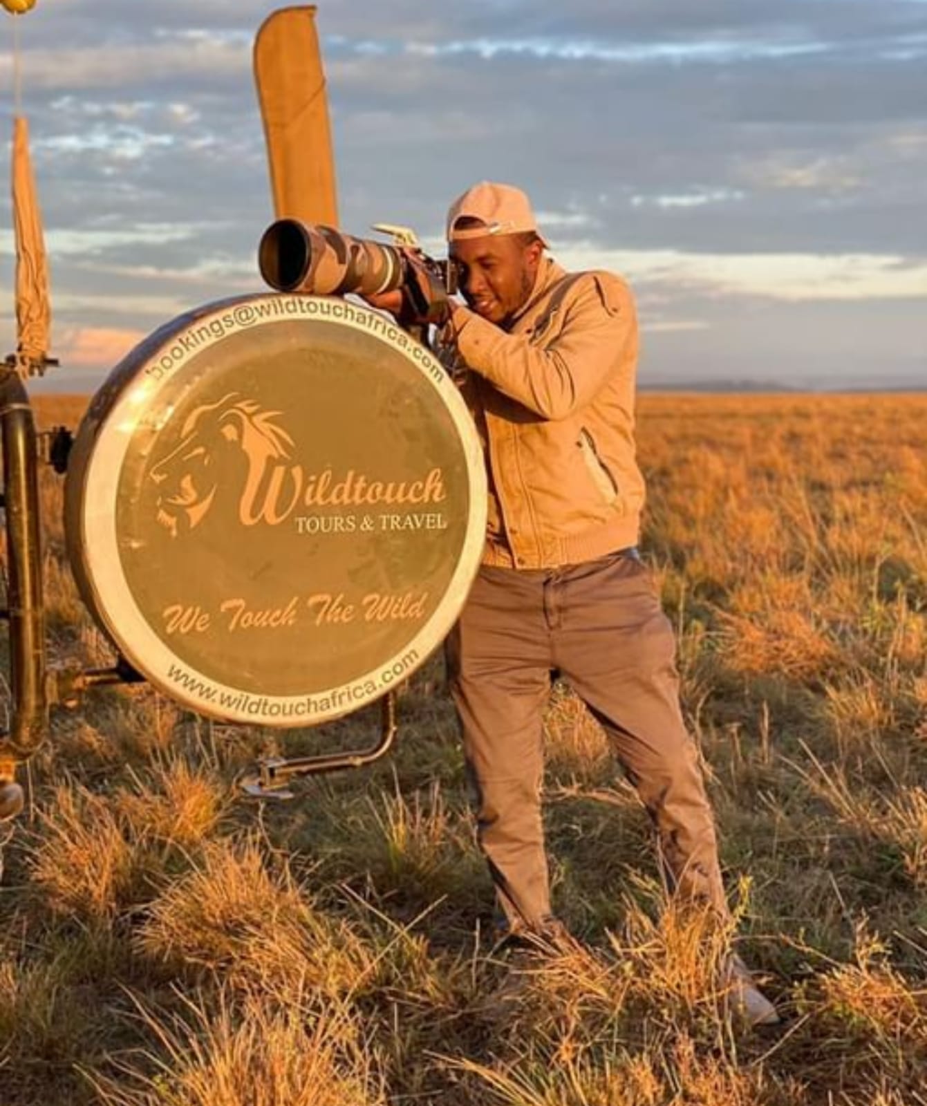 Jacob Munene of Wildtouch Tours & Travel at golden hour in the East African bush